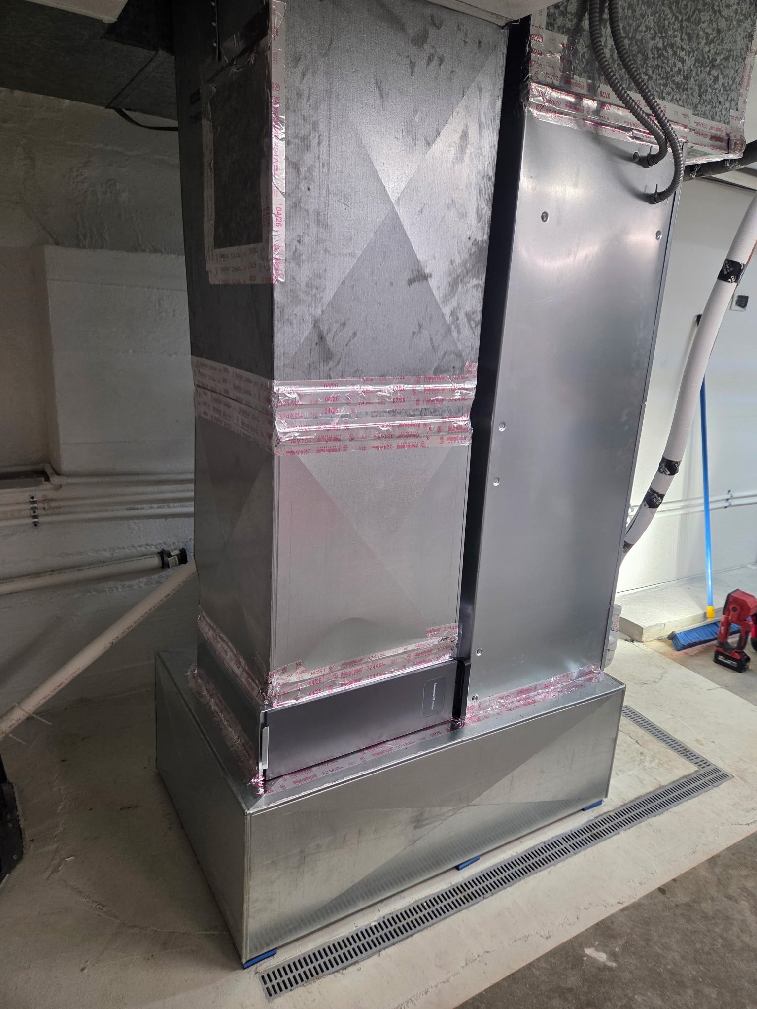 High-quality basement HVAC system installation featuring precise sheet metal work completed by Garry Viar of Viarbros